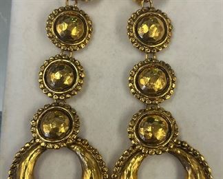 Large gold dangle Chanel earrings.