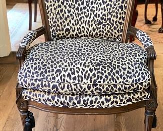 Antique Bergere chair upholstered in Schumacher leopard print fabric with tassel adornments on legs. Measures 26" W x 27"D. Photo 1 of 4.