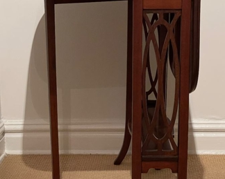 Vintage Mahogany Drop-Leaf Side Table with Fretwork Detailing. Measures 7" D x 26.5" W x 27" H with Sides Down. Each Leaf is 12.5" W. Photo 1 of 4. 