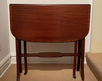 Vintage Mahogany Drop-Leaf Side Table with Fretwork Detailing. Measures 7" D x 26.5" W x 27" H with Sides Down. Each Leaf is 12.5" W.  Photo 3 of 4. 