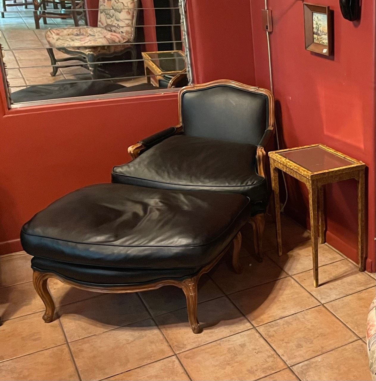 Faux leather chair with ottoman $600. Mirror and faux finished side table. 