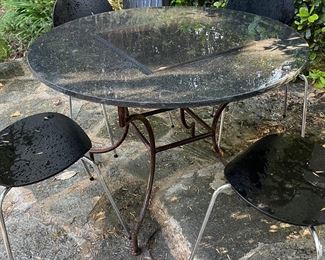 Granite and wrought iron table seats 4-6. $400
