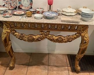 Granite and gold leaf console $1,200 OBO. Measures 5'7" x 1'6" deep x 2'9" tall. Assorted Japanese dishes and Limoges.