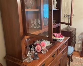 China cabinet with glassware and china.