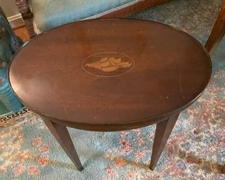 Wooden circular side table.