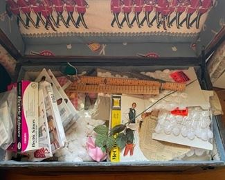 Trunk full of patterns and craft items.