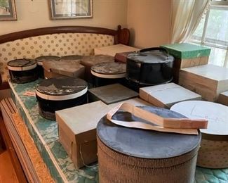 Vintage hat boxes with hats.