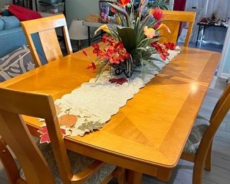 Maple Wood Dining Set shown without leaf. 2 Captains Chairs & 2 Side Chairs, table pads included