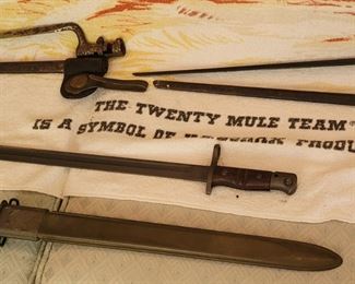 Late 1800s bayonets with scabbard at top. US M1917 Remington bayonets with scabbard at bottom