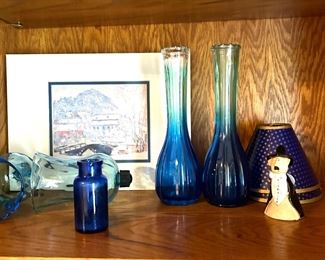 Blue glass vases and Monet print