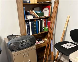 bookcase, file cabinet, easel, radio