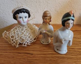 Antique German Pin Cushion Procelain Topper on the Right and the others also are Pin Cushion Toppers. 