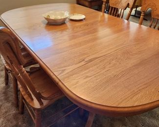 Dining Table w/2 Leafs (one in place) and 8 Cane Seat Dining Chairs. 