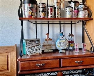 Bakers Rack, vintage liquor bottles, vintage ice buckets and pitchers