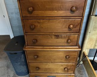 In the same room is this five-drawer dresser.