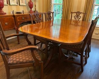 Mahogany banded Dinining room set with 8 chairs and matching buffet/sideboard.  Table has 2 leaves along with table mat