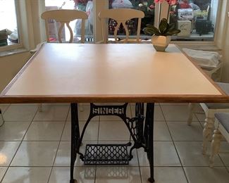 Kitchen table top with Singer sewing machine base