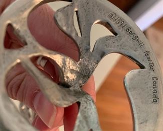 Bottom of pewter statue