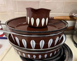 Katherine Holmes 
Brown/white pots and Pans 