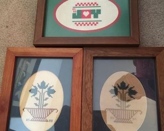 Trio of needlepoint pieces by unknown creator. Joy frame is 7.75x5.75 inches. 
Frames for the two flower basket pieces are 6x8 inches. 