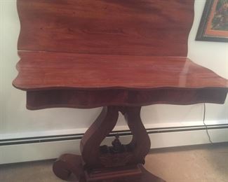 A card table with the leaf propped open. Notice the sturdy lyre-inspired base. 
