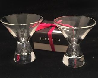 The martini glass’s sturdy vase shows an air bubble. The six are made by Steuben Glass. 