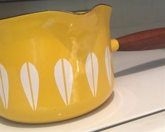 A Catherineholm melting pot in cheery yellow adds a vintage pop of color. 