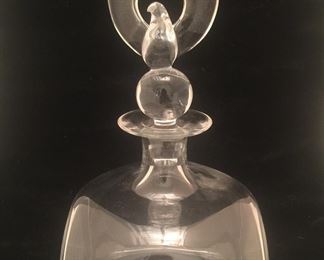 An eagle stopper tops this hefty carafe by Steuben Glass. 