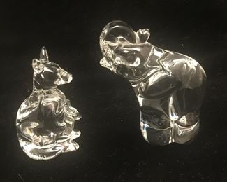 A kangaroo with a joey in pouch and an elephant. 