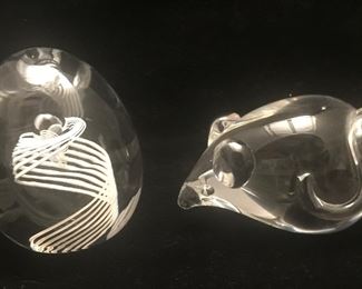 An egg-shaped orb with a helix-like design and a mouse. 