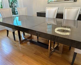 City Dining Table by Hurtado. 47" wide x 104" long (pictured with one leaf, one additional leaf included) stainless steel base
