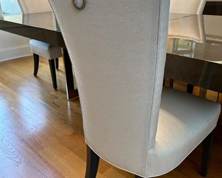 8 white upholstered chairs from Furnitureland South. These will be sold with the dining table as a set. Table + 8 chairs 