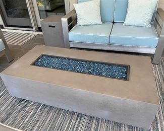 56” x 26” fire table. includes hose to propane tank cover