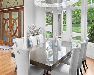 City Dining Table by Hurtado. 47" wide x 104" long (pictured with one leaf, one additional leaf included) stainless steel base