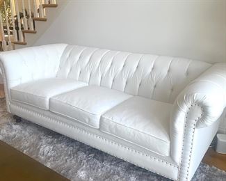white Chesterfield sofa by Klaussner Distinctions. 93" long, 41"tall.