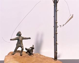 Vintage mid century brass and marble figurine of a child with a kite snagged on a telephone pole by Curtis Jere 