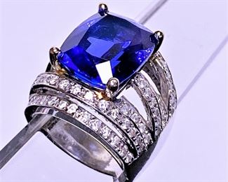 10.49 Cushion AAA Tanzanite 14k white gold ring with 88 round diamonds.   This will not go to 1/2 off. 