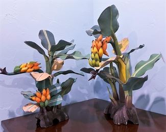 Hand painted banana tree wooden sculptures that were purchased in the 1980s from a local woman  artisan on the Cayman Island.   
