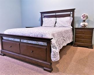 Nice 3 piece bedroom set by Folio 21.  A queen size bed with two lower drawers at the footboard and two matching nightstands.  