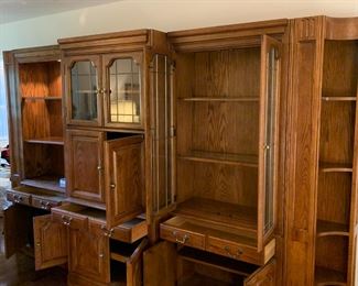 #7	Oak 3 piece Entertainment Center w/ Side Cabinet (Lighted 2 glass shelves) w/Glass Doors Leaded w/1 drawer & 2 doors w/corner Bookcase - 18Dx50Lx81T, Center Entr. 6 doors w/2 leaded glass doors & 2 wood Shelves - 22Dx36x81H   Left Side Cabinet w/1 glass, 1 wood Shelf & 2 doors - 18Dx51Hx81T   You MOve - 	 $275.00 
