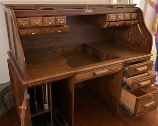 #17	Oak Winners Only Inc. Rolltop Desk w/12 cubbies & drop-down keyboard w/sides pull-out tray desk w/2 doors & 3 drawers w/locking side drawer - 33Dx60x52	 $375.00 
