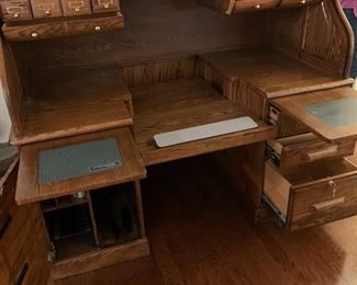 #17	Oak Winners Only Inc. Rolltop Desk w/12 cubbies & drop-down keyboard w/sides pull-out tray desk w/2 doors & 3 drawers w/locking side drawer - 33Dx60x52	 $375.00 
