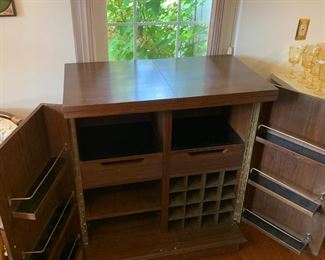 #94	Mid-Century Asian Carved  Rolling Bar w/flip-open top w/green marble Top, has wine cubbies and 2 drawers & Wine Inserts - 3'-6' x 20"Dx41	 $300.00 
