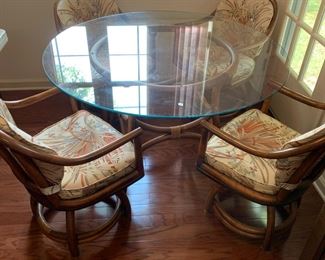 #95	Classic Rattan Bamboo Table w/glass top and 4 bamboo Swivel Chairs w/cushions - 4' Round x 29"T	 $450.00 
