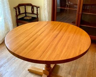Round oak pedestal dining table and four chairs
