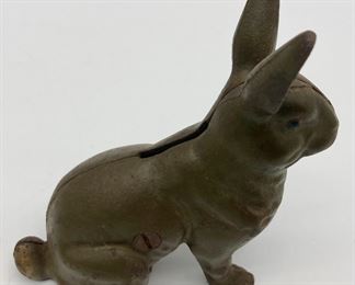 Antique metal bunny coin bank