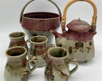 Pottery teapot and four mugs, flower basket