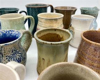 Assorted pottery mugs, including Mack Chrisco, Turn and Burn pottery, Uwharrie Crystalline Pottery, Daniel Marley, Mike Ferree, Hickory Hill, Jug or Not Pottery