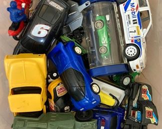 Assorted medium and small toy cars, trucks, tanks