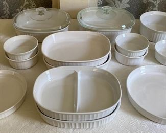Assorted white CorningWare baking and storage pieces